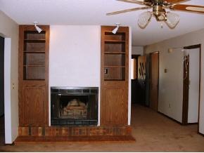 8026 East Barbara Road, Unit 1 Prescott Valley, AZ 86314 - Photo 4 of 10 a living room with furniture a fireplace and a chandelier