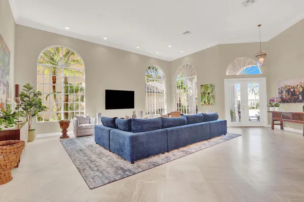 a view of a dining room with furniture and chandelier