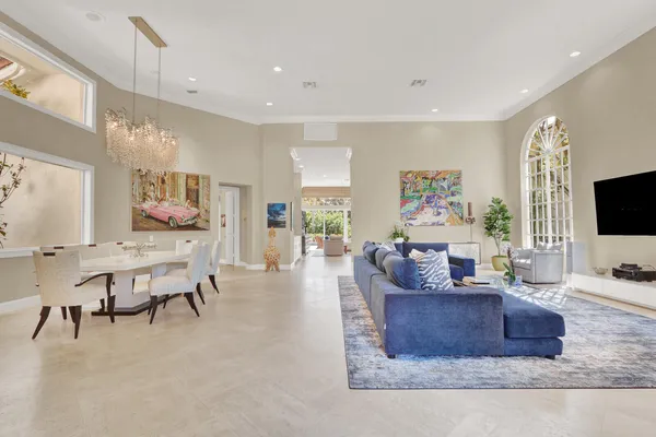 a view of kitchen with stainless steel appliances granite countertop a sink and cabinets