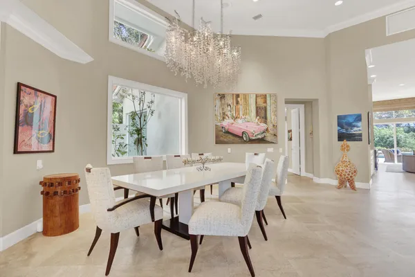 a kitchen with stainless steel appliances granite countertop a sink dishwasher stove and white cabinets with wooden floor