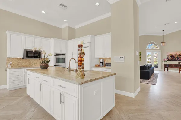 a dining room with furniture a large window and outside view