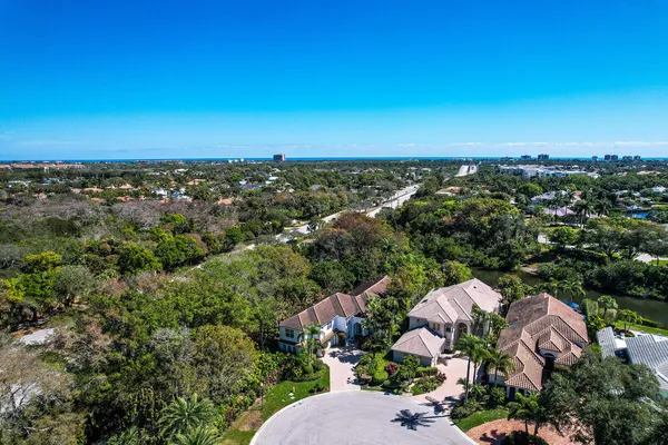a swimming pool with outdoor seating and yard