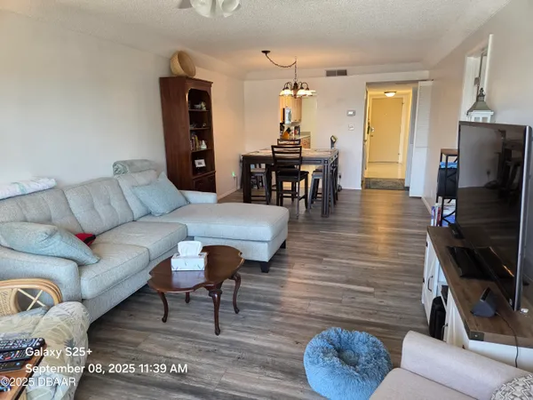 a bed sitting in a bedroom next to a lamp