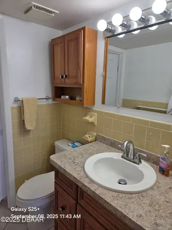 a view of balcony with furniture