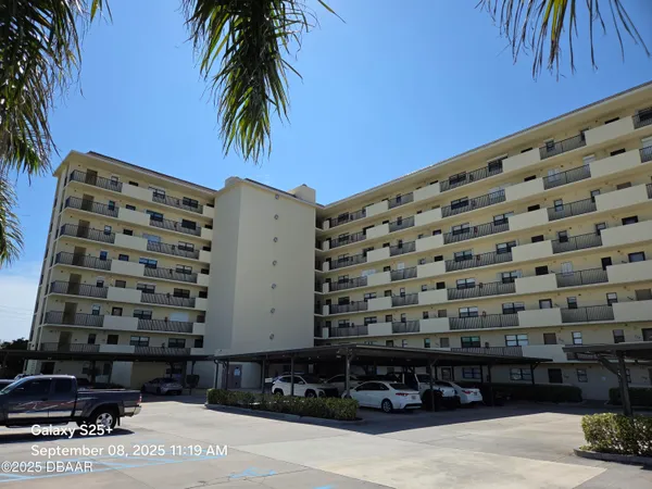 a view of building with yard