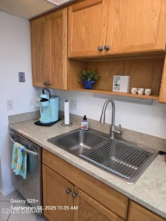 a stove top oven sitting inside of a kitchen