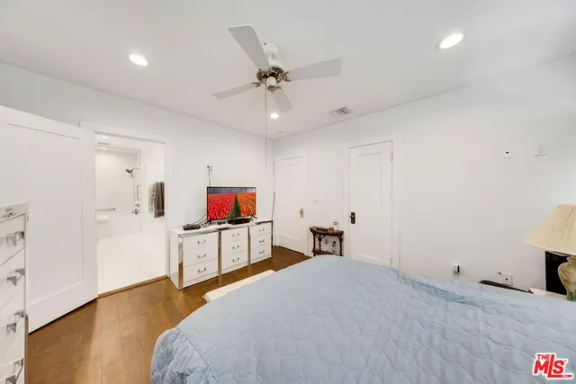 a bathroom with a tub a sink and shower