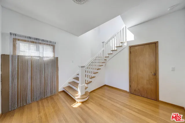 a view of entryway with wooden floor