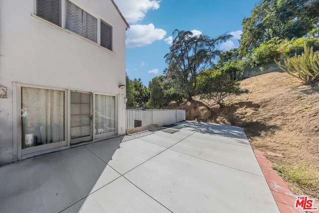 a view of a street with a building in the background