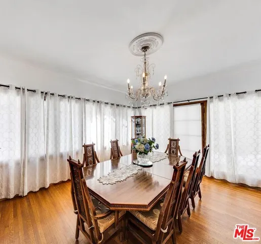 a kitchen with a stove a sink dishwasher and a refrigerator