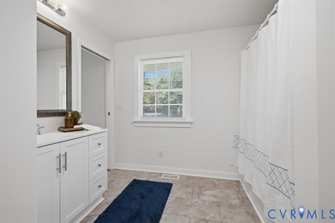 2338 George's Road Powhatan, VA 23139 - Photo 10 of 25 White vanity with a rectangular sink, wall-mounted
