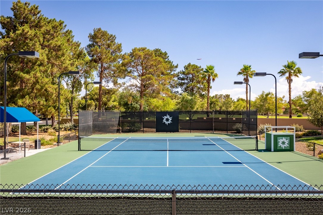 20 Innisbrook Avenue Las Vegas, NV 89113 - Photo 38 of 39 An all-weather surface tennis court invites active recreation under clear skies.