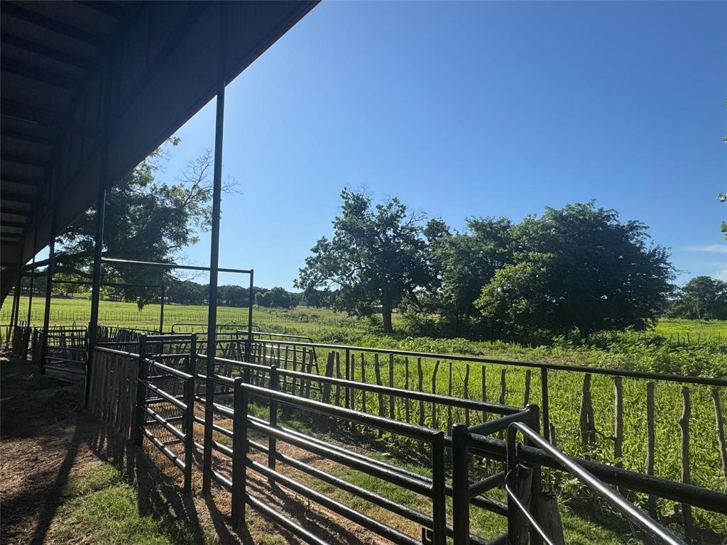 377 Private Road 3249, Unit ARENA Decatur, TX 76234 - Photo 21 of 40 a view of a balcony with a floor to ceiling window and wooden fence