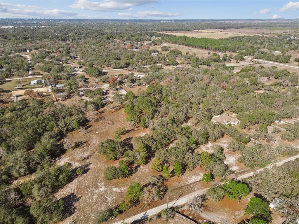 14459 Coyote Road Hudson, FL 34669 - Photo 31 of 55 an aerial view of residential houses with outdoor space