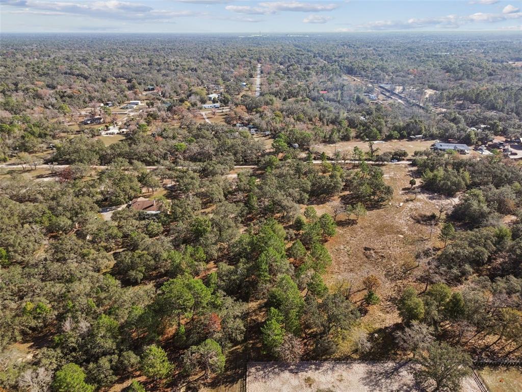 14459 Coyote Road Hudson, FL 34669 - Photo 39 of 55 an aerial view of residential houses and outdoor space