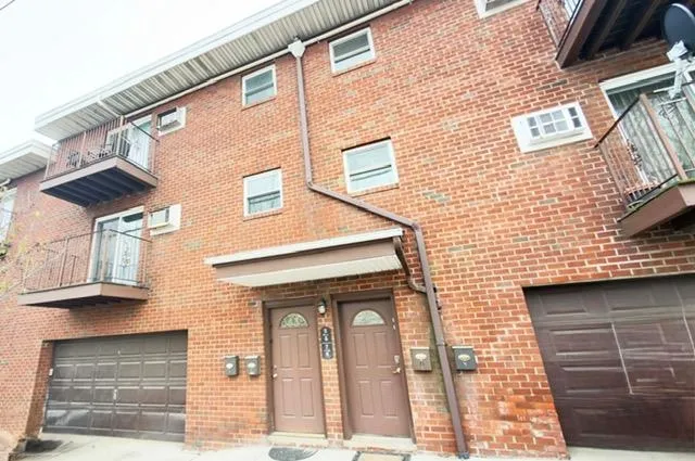 a front view of a building with many windows