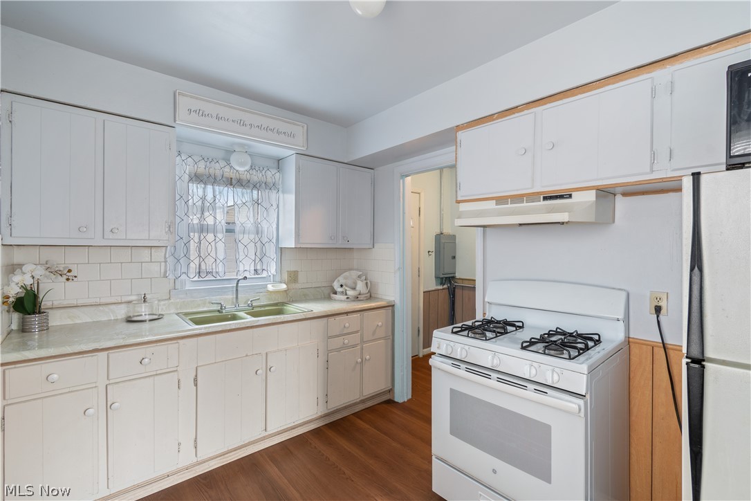 Efficiency kitchen adjacent laundry & laundry room