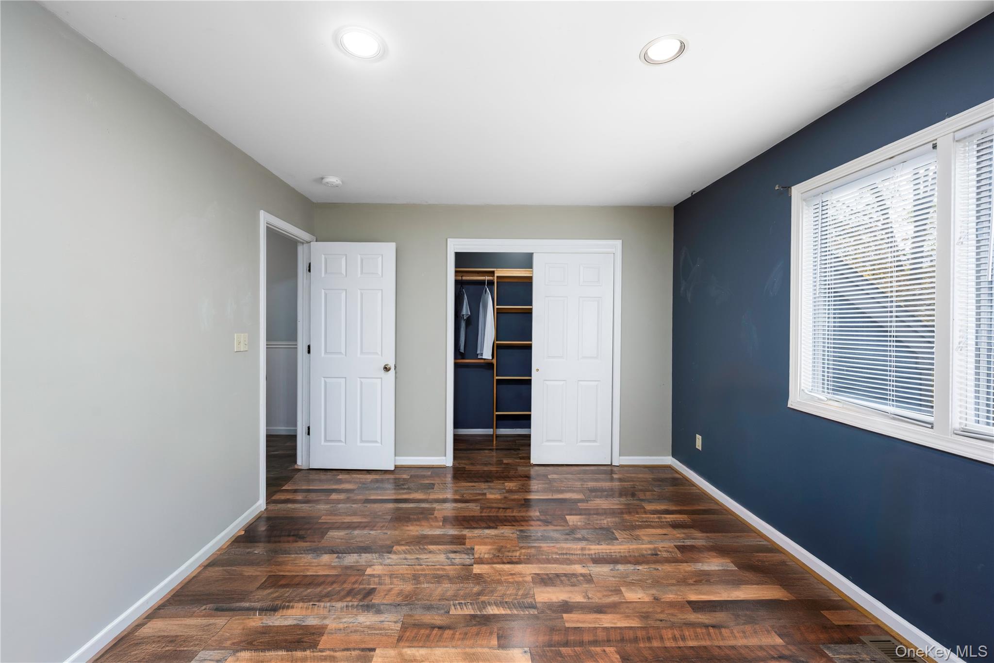 5704 Manor Drive Peekskill, NY 10566 - Photo 15 of 39 a view of an empty room with wooden floor and window