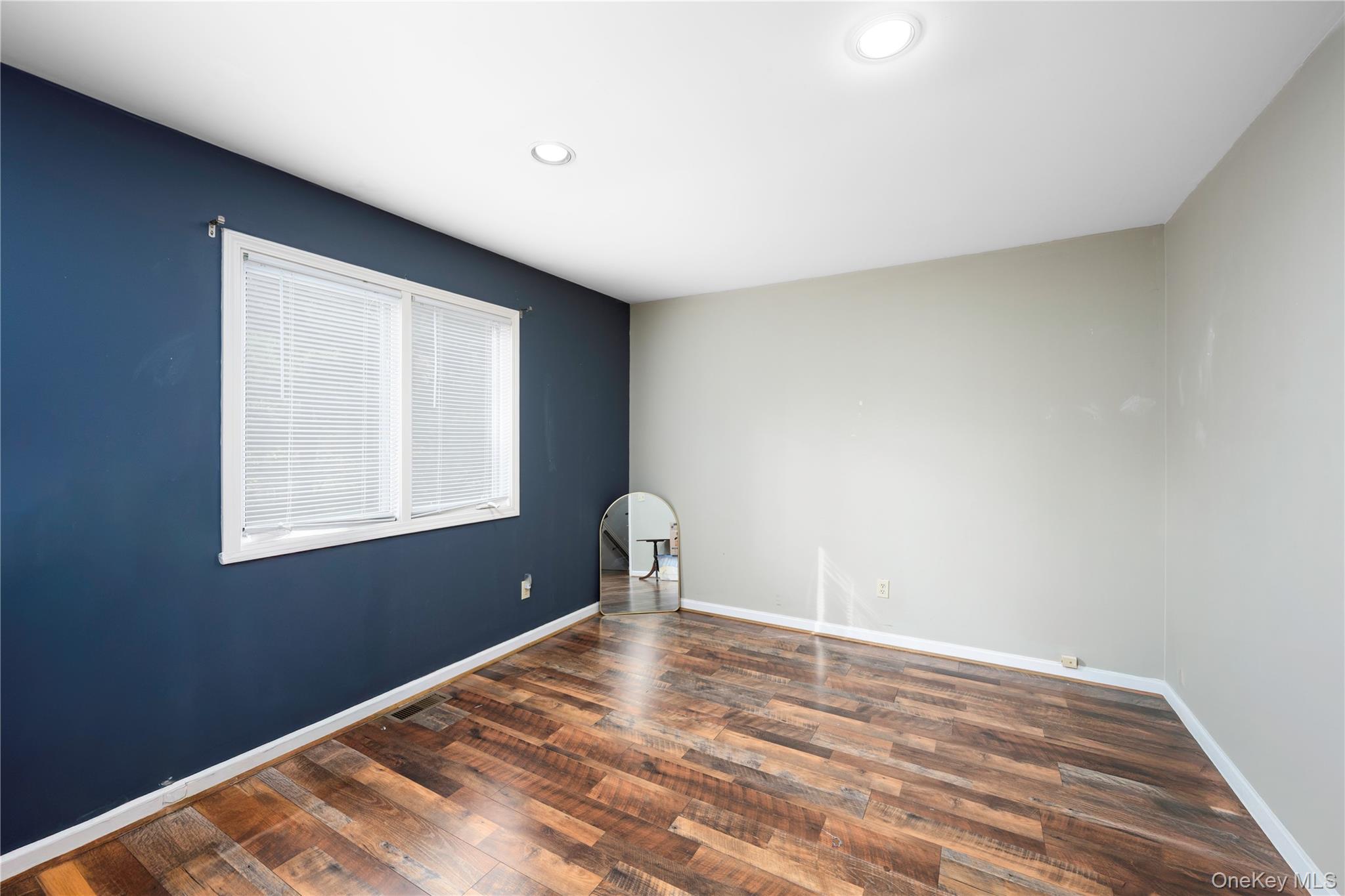 5704 Manor Drive Peekskill, NY 10566 - Photo 16 of 39 a view of a room with a window and wooden floor