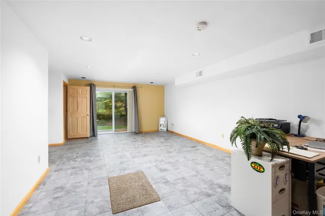 a view of room with furniture and window