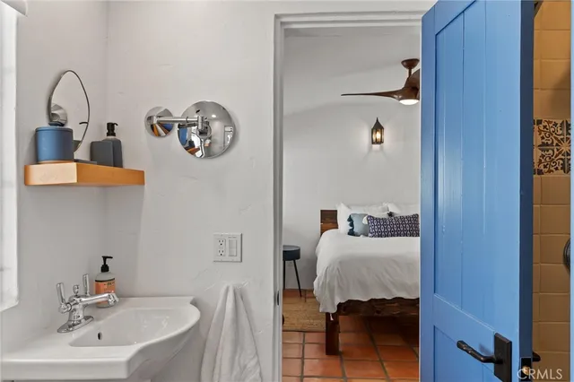 a bathroom with a sink and a mirror