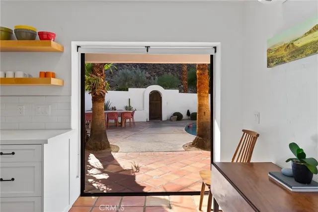 a view of living room with furniture and wooden floor