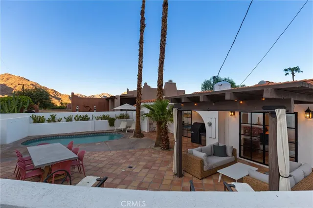 a view of living room filled with furniture and city view