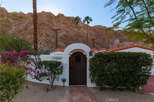 a view of a terrace with a garden and mountain view