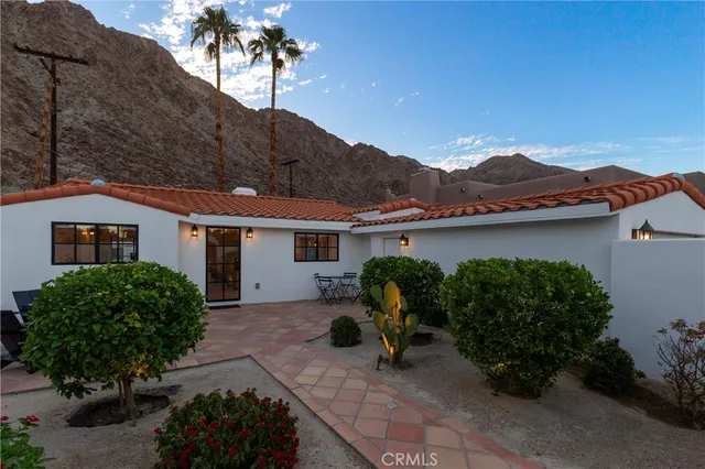 a house view with a garden space