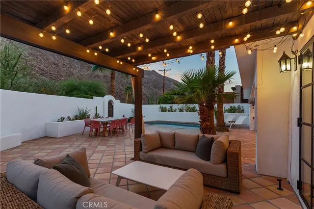 a outdoor living space with furniture and a potted plant