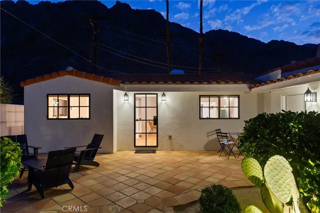 a bed sitting in a room next to a window