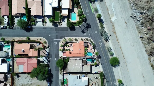 an aerial view of a house with outdoor space