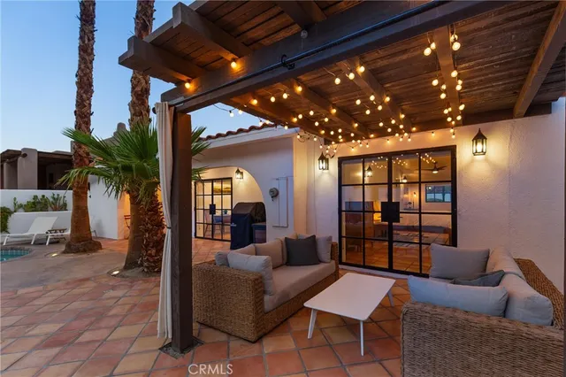 a outdoor living space with furniture and a potted plant