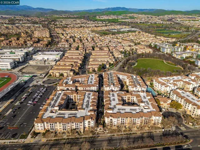 an aerial view of residential building and ocean view