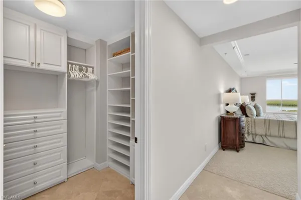 a view of cabinets and walk in closet