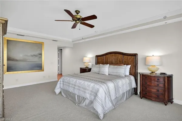 a bedroom with a bed dresser and a window