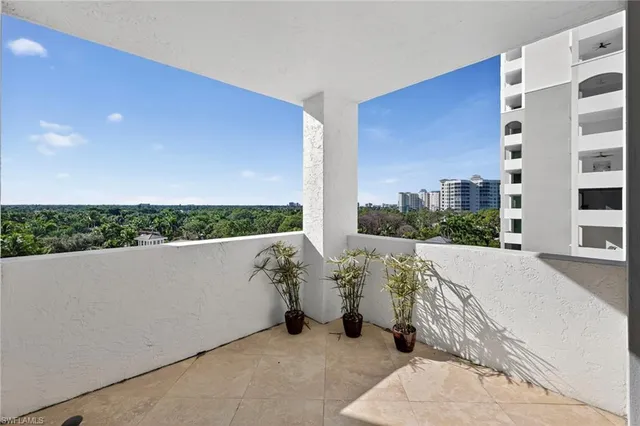 a view of balcony with furniture
