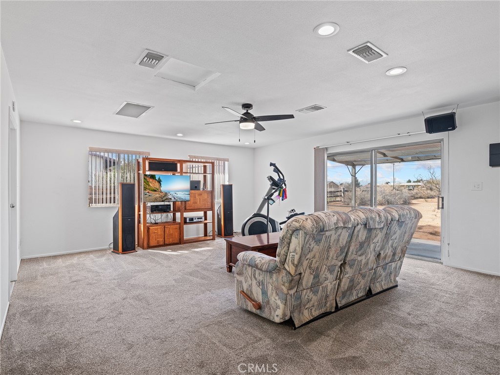 14060 Osage Road Apple Valley, CA 92307 - Photo 15 of 39 a living room with furniture and a large window