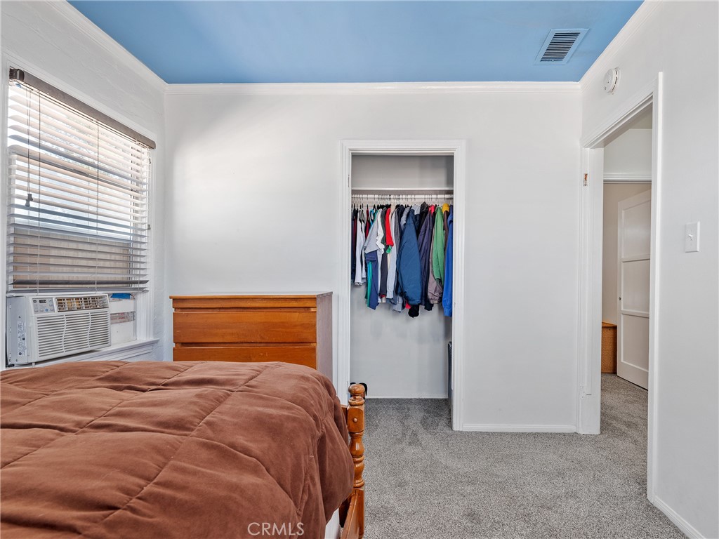 14060 Osage Road Apple Valley, CA 92307 - Photo 22 of 39 a bedroom with a bed and a window