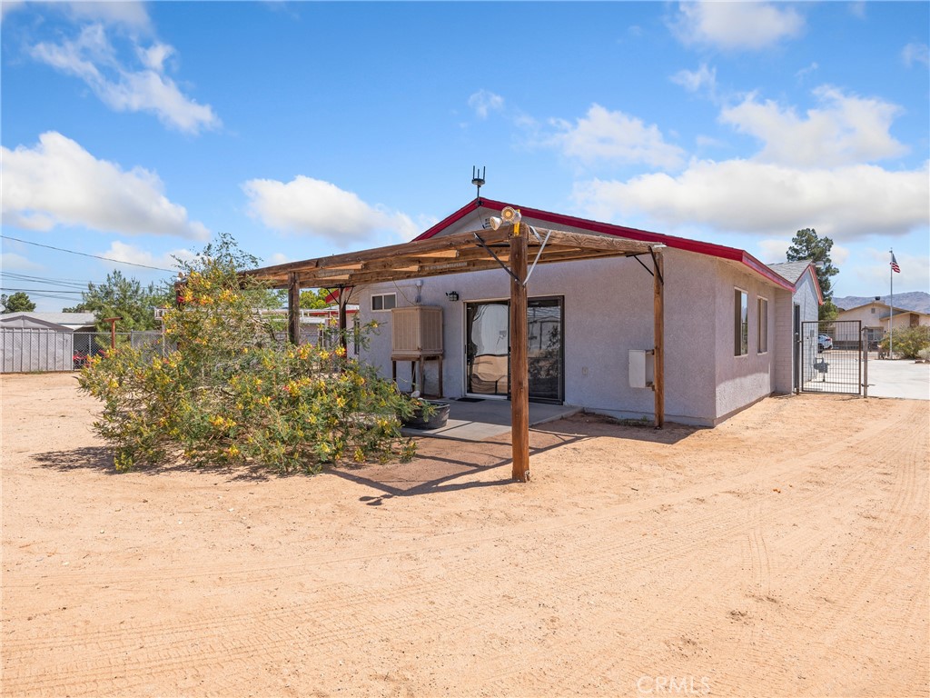 14060 Osage Road Apple Valley, CA 92307 - Photo 30 of 39 a front view of a house with a yard
