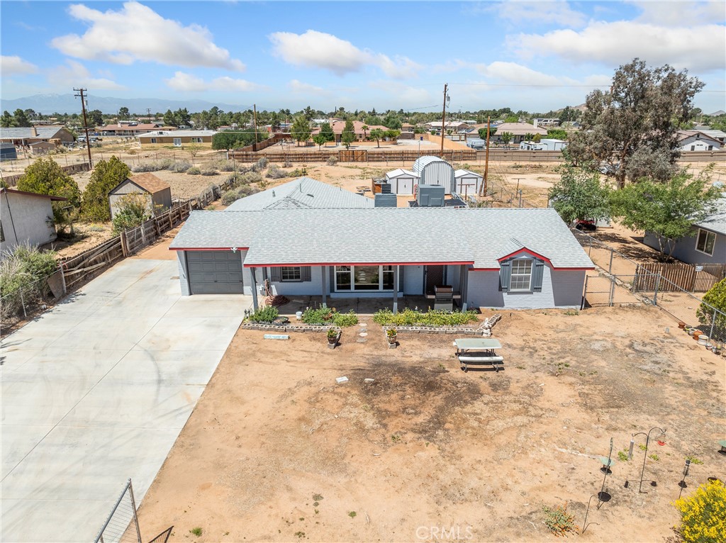 14060 Osage Road Apple Valley, CA 92307 - Photo 34 of 39 a view of a house with a swimming pool