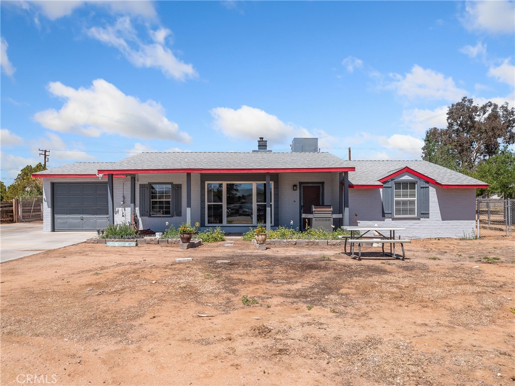 14060 Osage Road Apple Valley, CA 92307 - Photo 38 of 39 a front view of a house with a sitting area