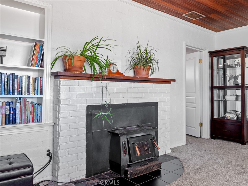 14060 Osage Road Apple Valley, CA 92307 - Photo 4 of 39 a living room with furniture and a fireplace