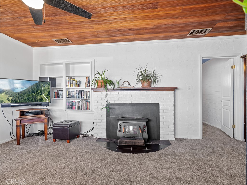 14060 Osage Road Apple Valley, CA 92307 - Photo 5 of 39 a living room with furniture and a fireplace