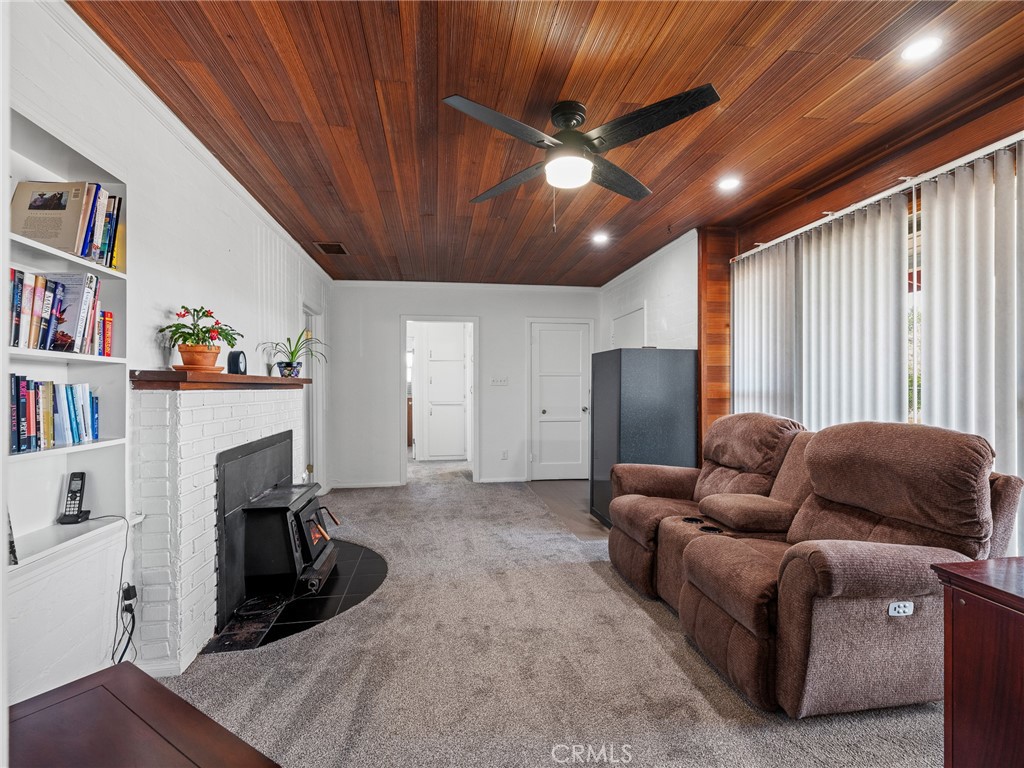 14060 Osage Road Apple Valley, CA 92307 - Photo 10 of 39 a living room with furniture and a flat screen tv