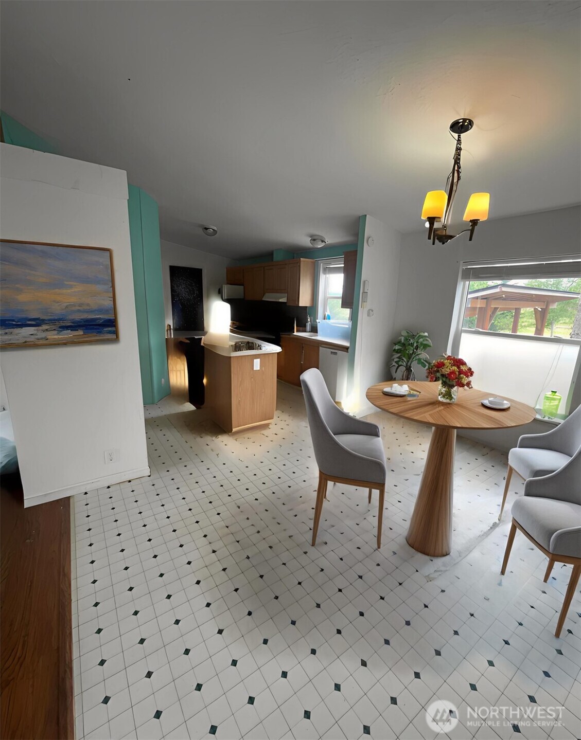 103 Noble Estates Drive Winlock, WA 98596 - Photo 2 of 11 a dining room filled a chandelier and kitchen view