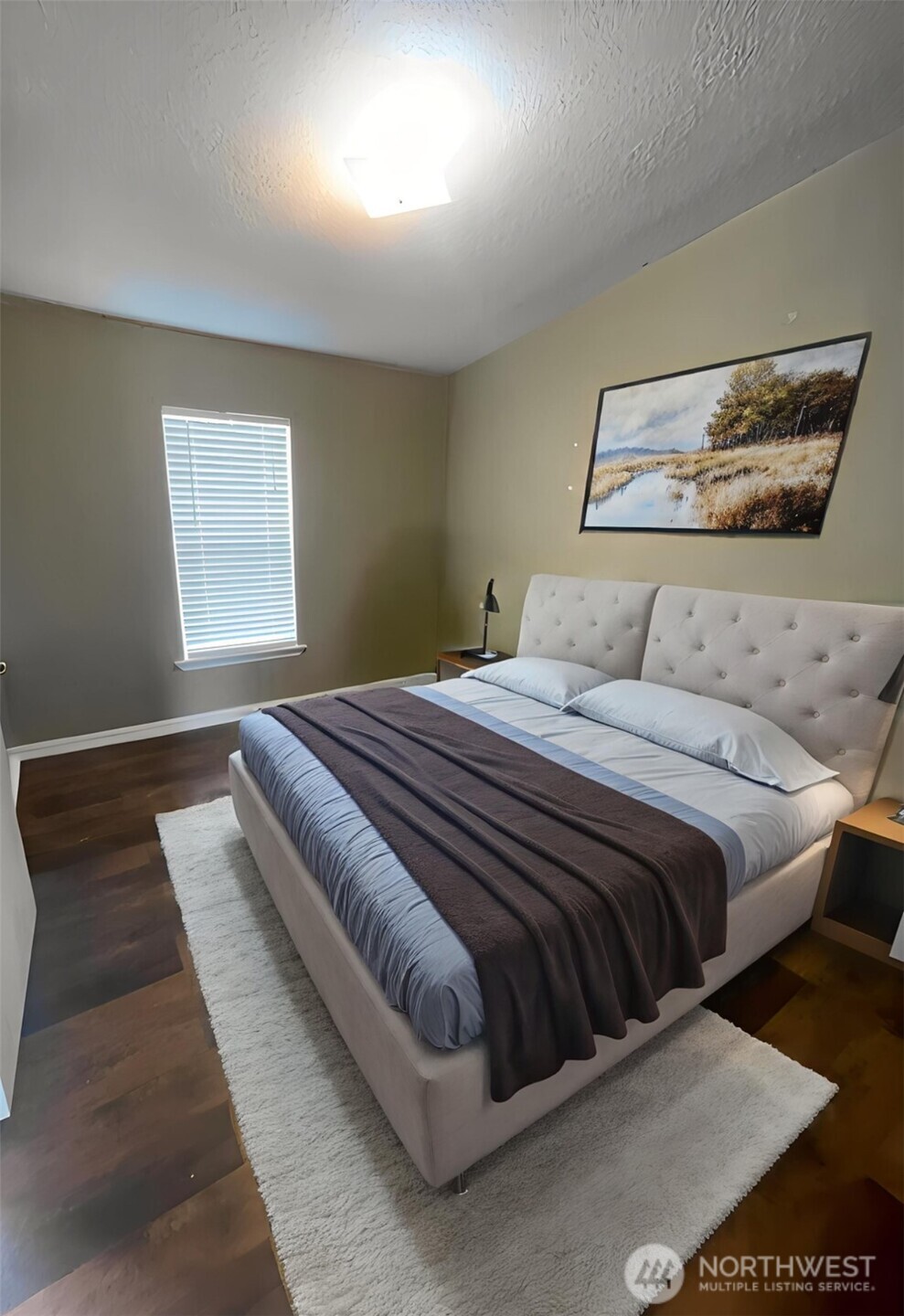 103 Noble Estates Drive Winlock, WA 98596 - Photo 4 of 11 a bedroom with a large bed and a couch