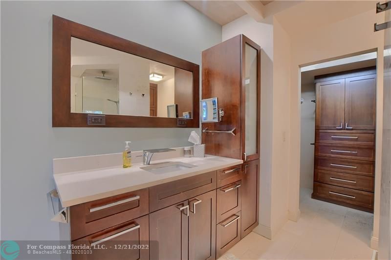 331 Southeast 4th Street Deerfield Beach, FL 33441 - Photo 19 of 37 a bathroom with a sink and a mirror
