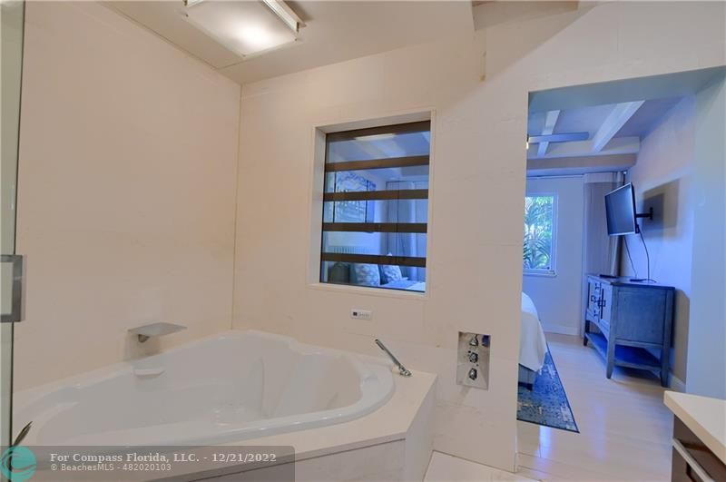 331 Southeast 4th Street Deerfield Beach, FL 33441 - Photo 20 of 37 a white bath tub sitting in a bathroom