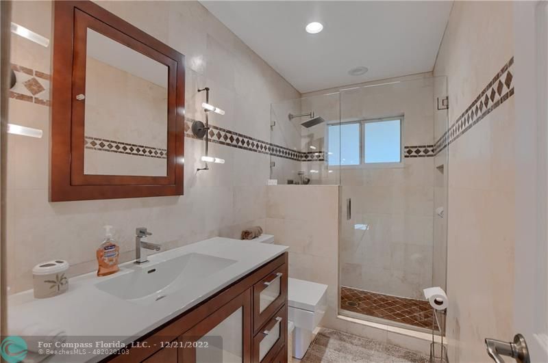 331 Southeast 4th Street Deerfield Beach, FL 33441 - Photo 26 of 37 a bathroom with a sink and a mirror